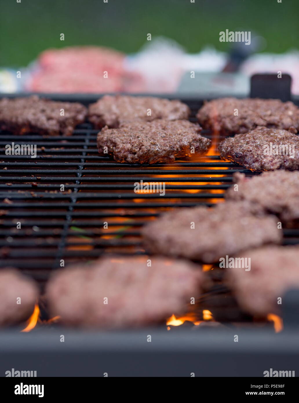Making hamburgers on the grill outdoor Stock Photo Alamy