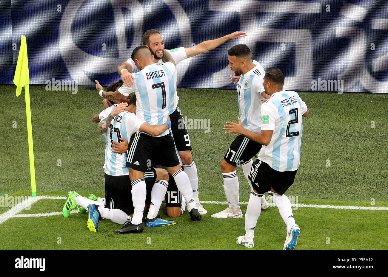 Argentina's Lionel Messi (obscured) celebrates scoring his side's first goal of the game with team-mates during the FIFA World Cup Group D match at Saint Petersburg Stadium. Stock Photo