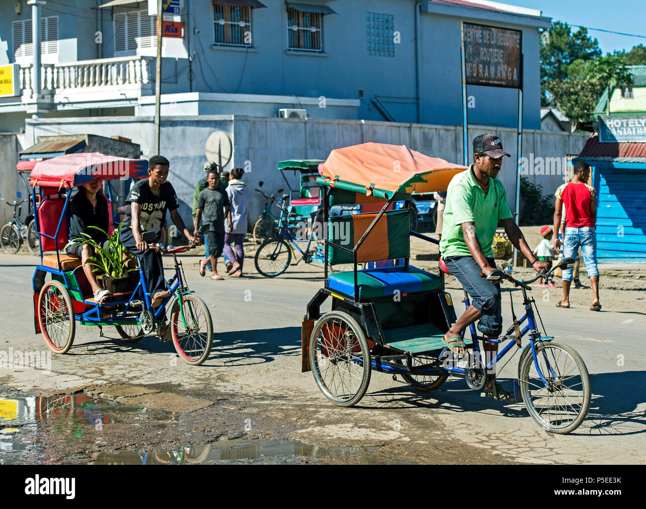 Rickshaw driver on road, Muramanga, Madagascar Stock Photo