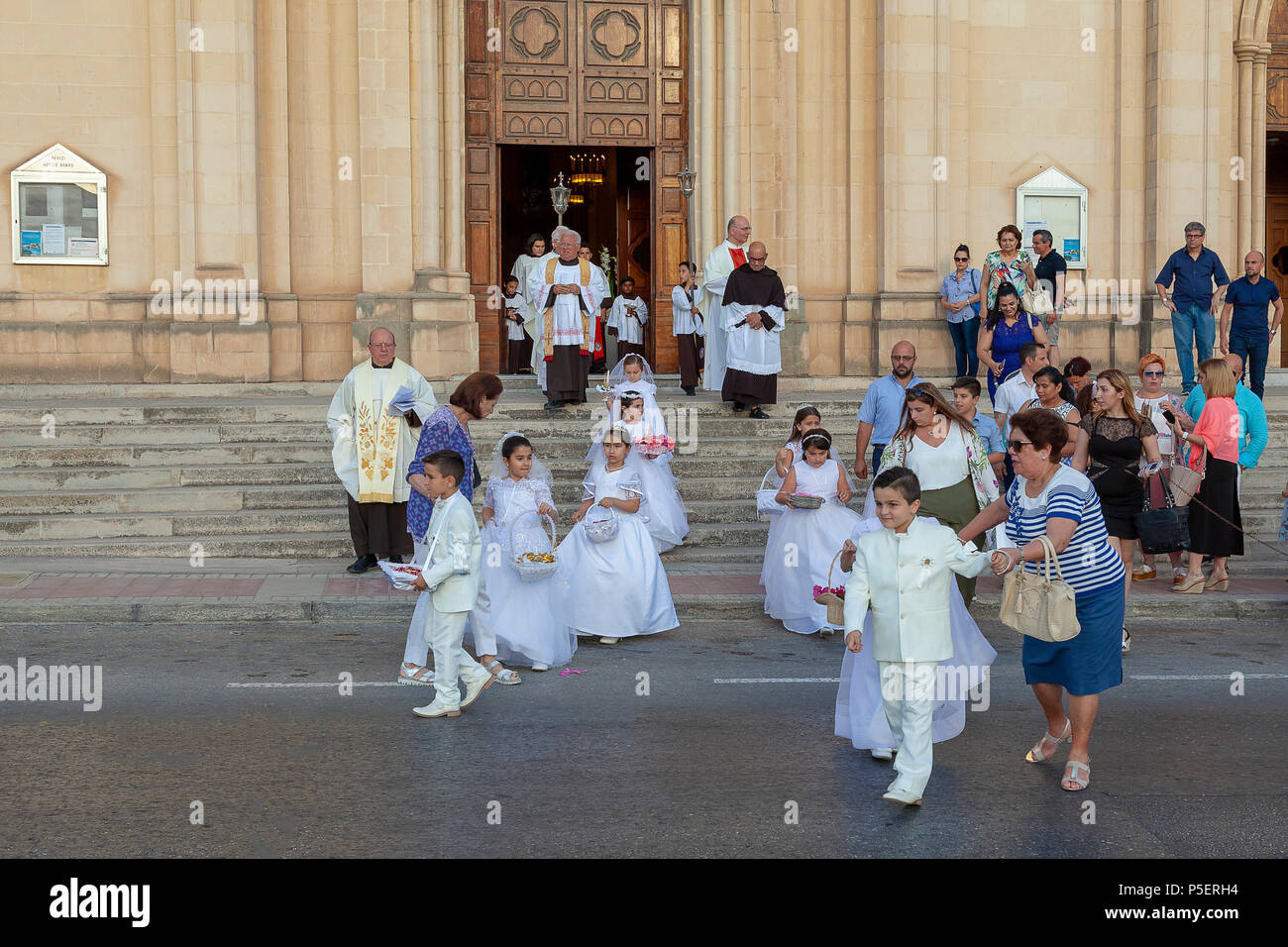 A children's first Communion Parade in St Julian's, Malta Stock Photo