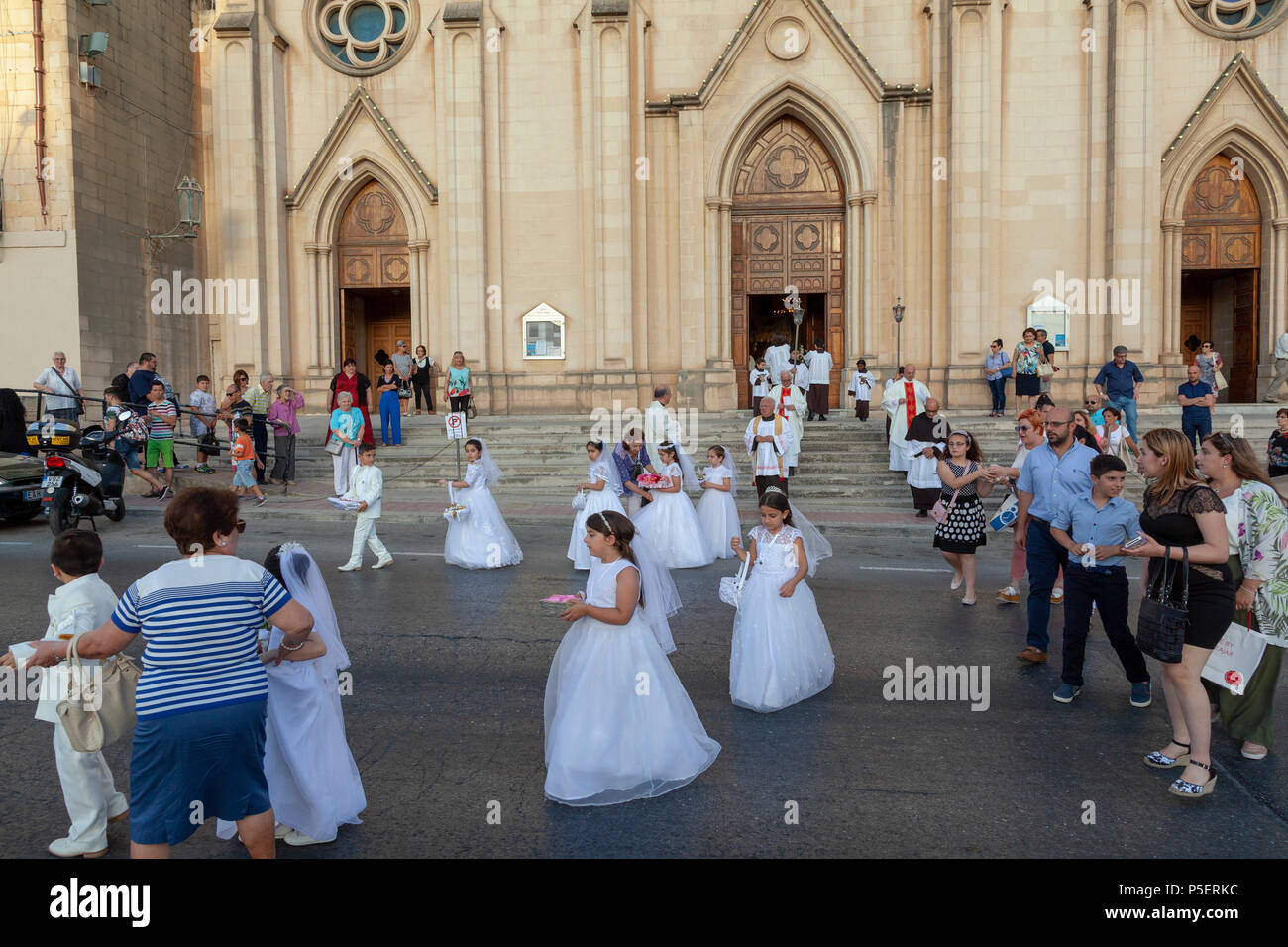 A children's first Communion Parade in St Julian's, Malta Stock Photo