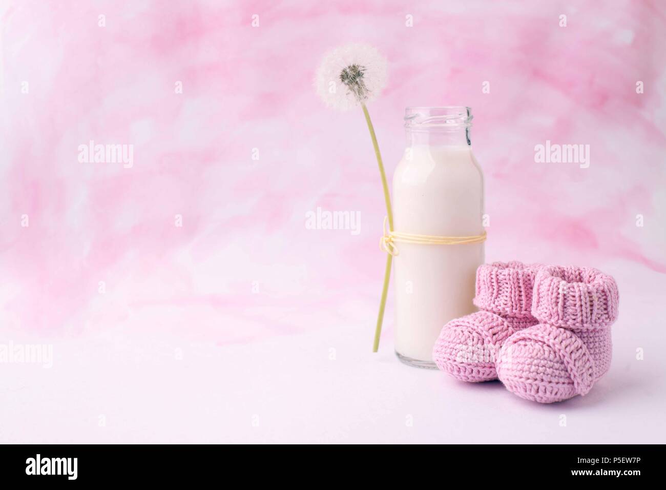 Its a girl pink theme baby shower or sip and see party background with  decorative elements - booties and milk bottle. Minimal, copy space Stock  Photo - Alamy
