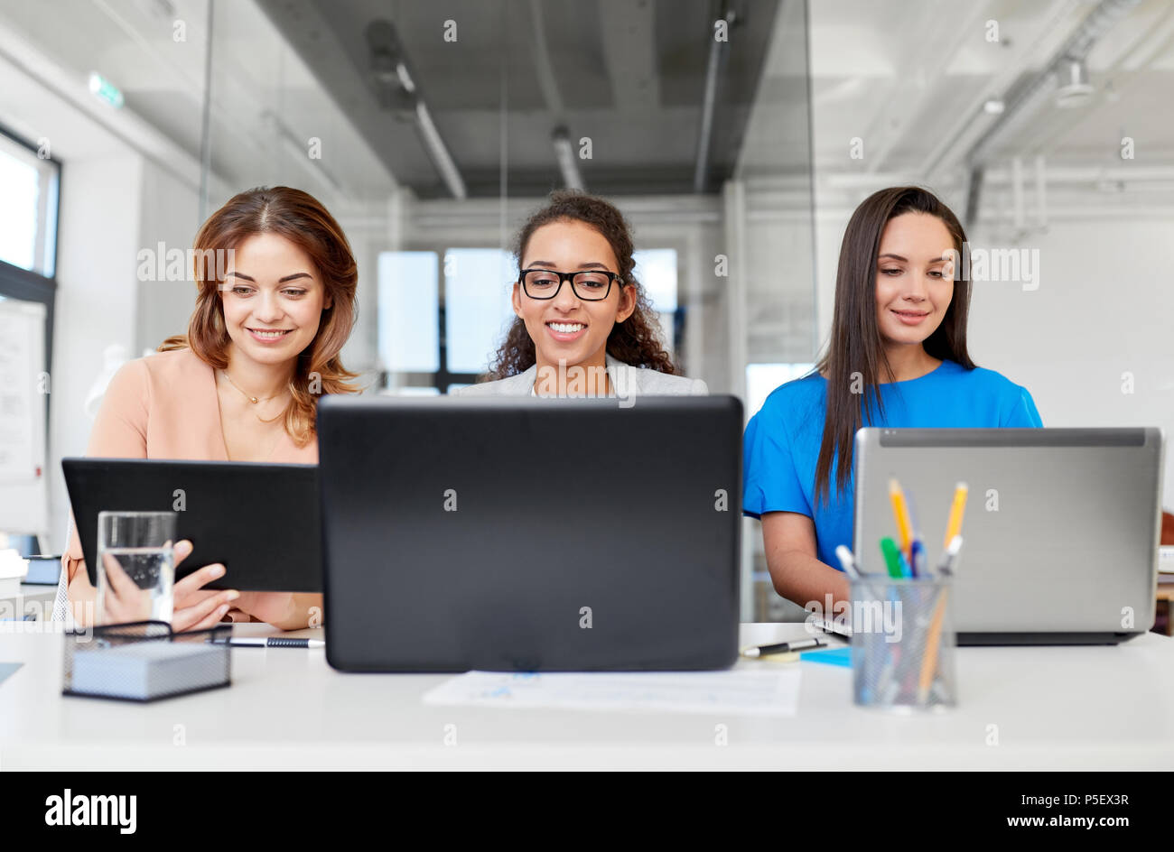 businesswomen with tablet pc and laptops at office Stock Photo