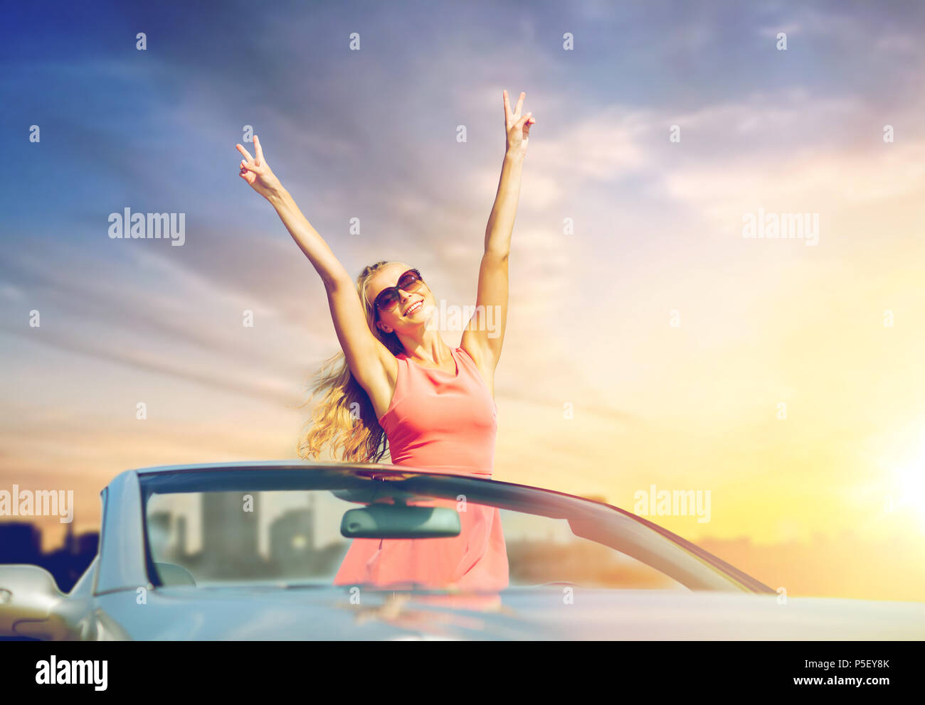 happy young woman in convertible car Stock Photo - Alamy