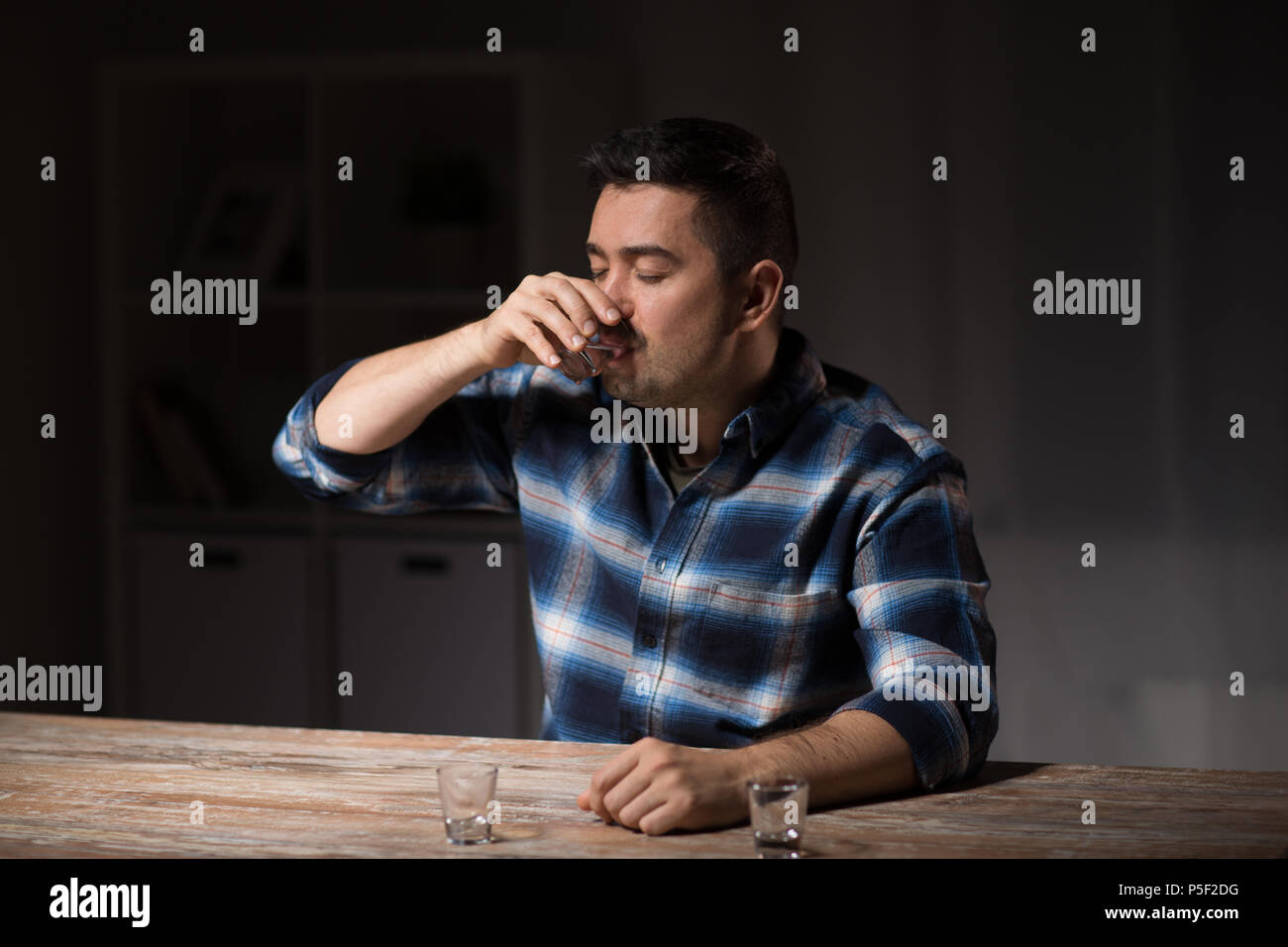 man drinking alcohol at night Stock Photo Alamy