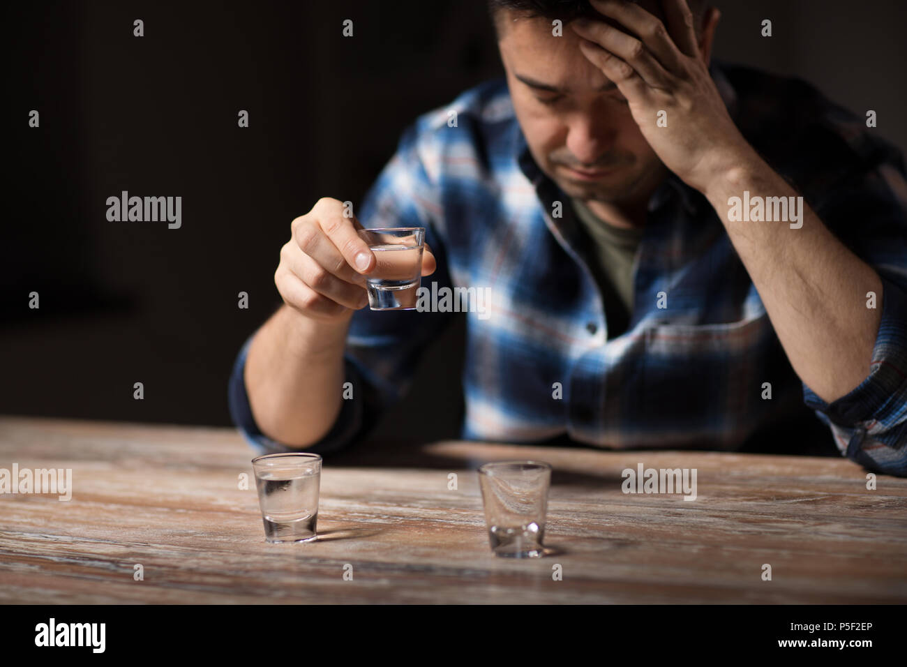 man drinking alcohol at night Stock Photo Alamy