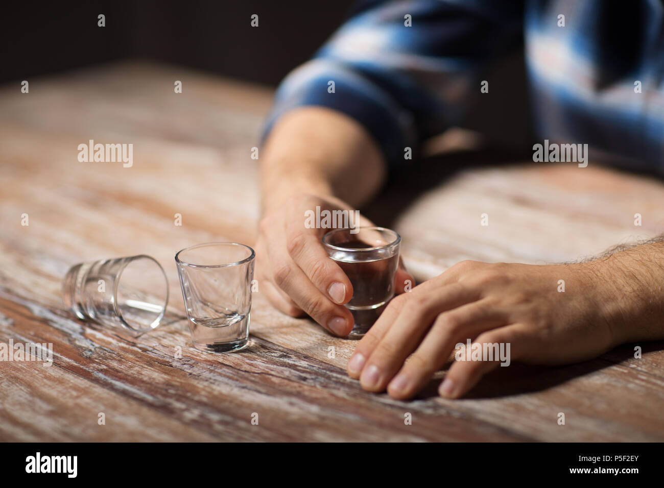 hands of alcoholic drinking vodka shots at night Stock Photo Alamy