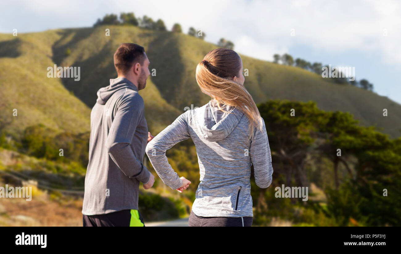 happy couple running outdoors Stock Photo - Alamy