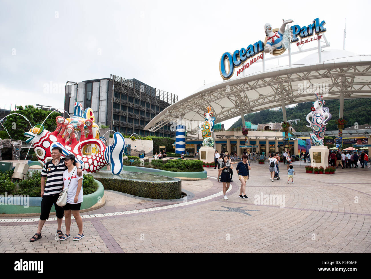 Tourists take pictures at the amusement and animal theme Ocean Park