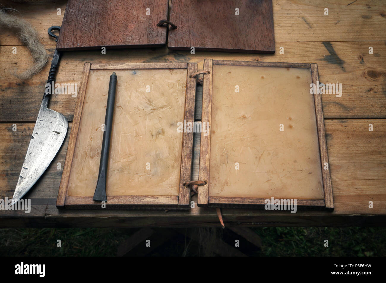 A replica Roman wax writing tablet with a metal stylus and a knife for