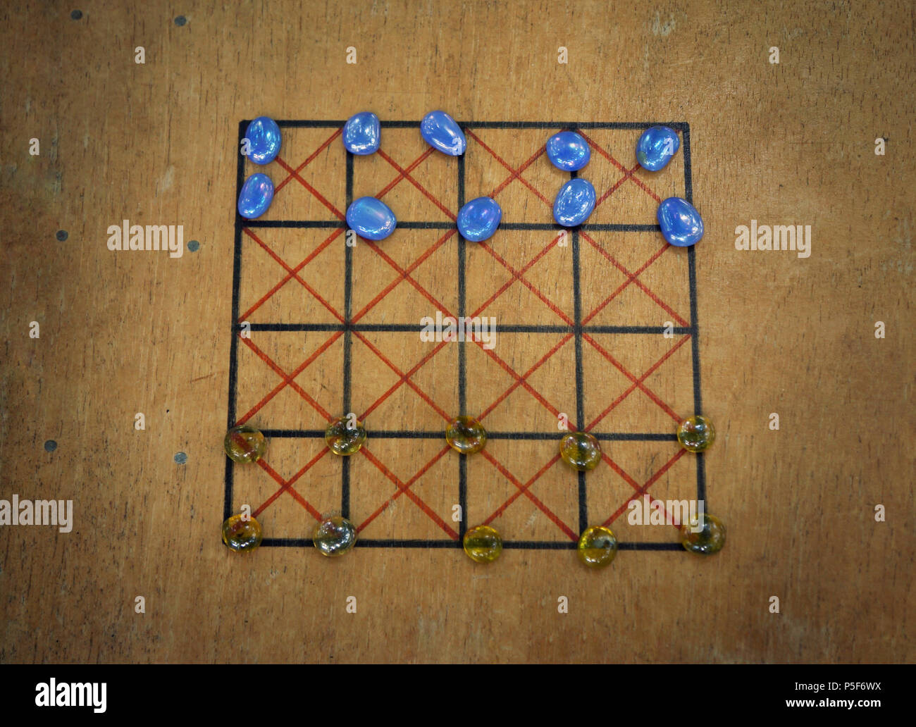 A replica of a roman board game with glass playing pieces. Stock Photo