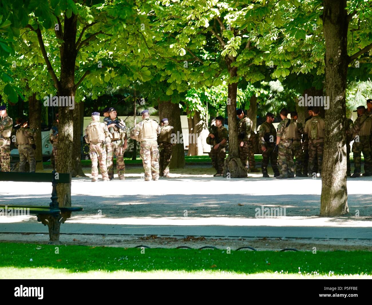 Members of a French military squadron preparing to begin patrol in the Luxembourg Gardens, Paris, France. Stock Photo
