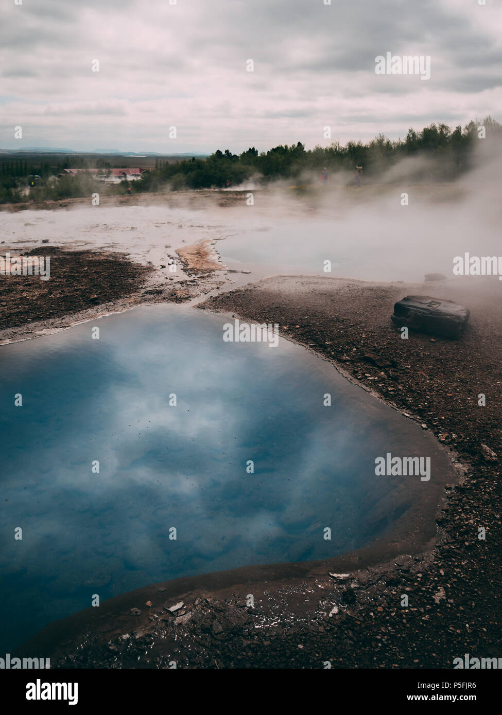 geysir hot very blue water spring with steam in iceland Stock Photo