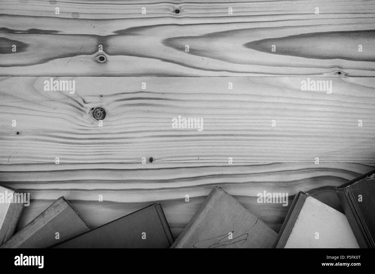 Old books on a wooden table in black and white Stock Photo - Alamy