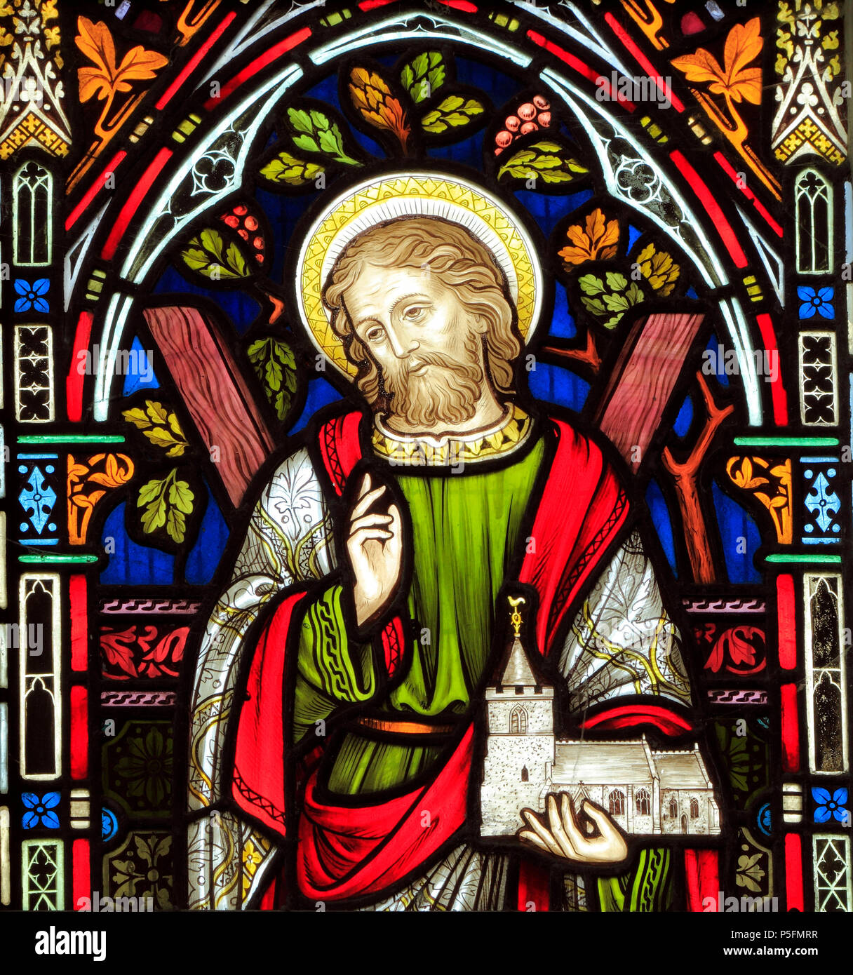 St. Andrew, holding model of St. Andrew's church, stained glass window, by Frederick Preedy, 1863, Ringstead, Norfolk, England Stock Photo
