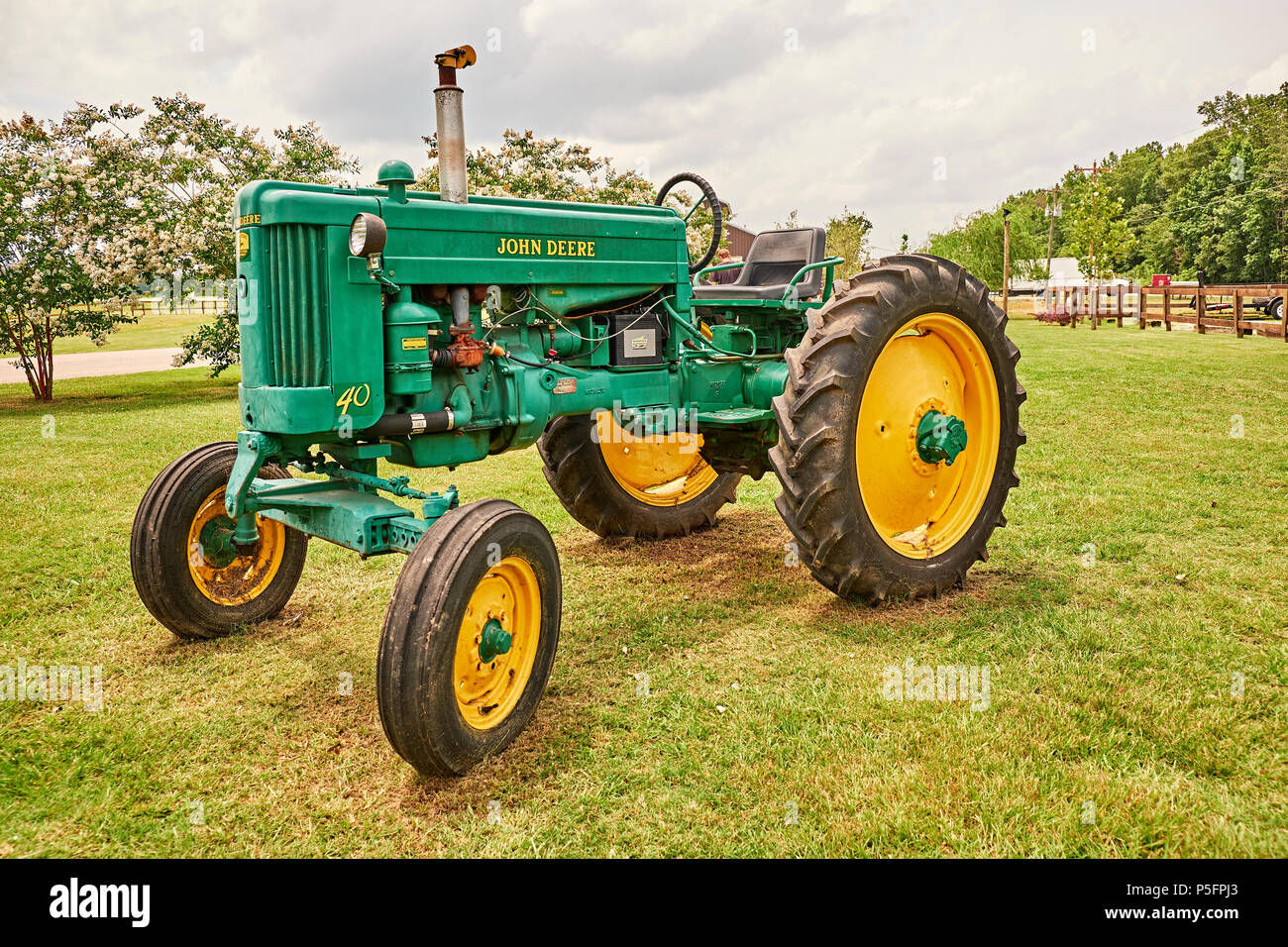 Antique green John Deere 40 tractor on display in rural Pike Road Alabama, USA. Stock Photo