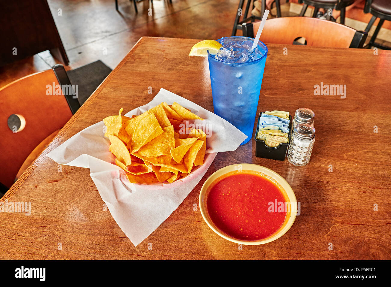 Chips and salsa or dip on a table top, shot from above, in a Mexican restaurant in Montgomery Alabama, USA. Stock Photo