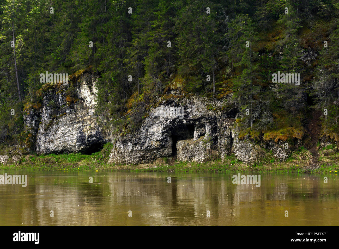 natural cave in the limestone cliff of the river bank Stock Photo Alamy