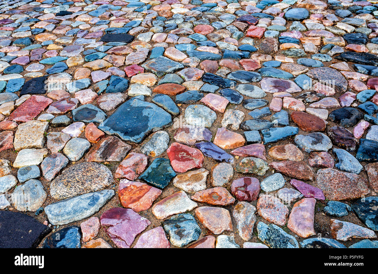 Old cobblestone roadway as creative background texture Stock Photo