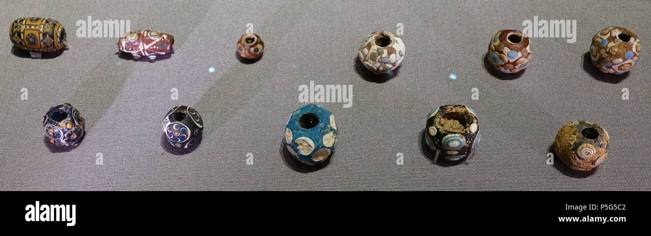 N/A. English: Exhibit in the Tokyo National Museum - Tokyo, Japan. 1 August 2017, 22:14:42. Daderot 179 Beads, China, Warring States period, 5th-3rd century BC, inlaid glass - Tokyo National Museum - Tokyo, Japan - DSC08519 Stock Photo
