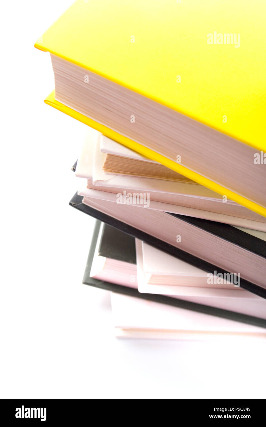 stack of books closeup on white background Stock Photo - Alamy