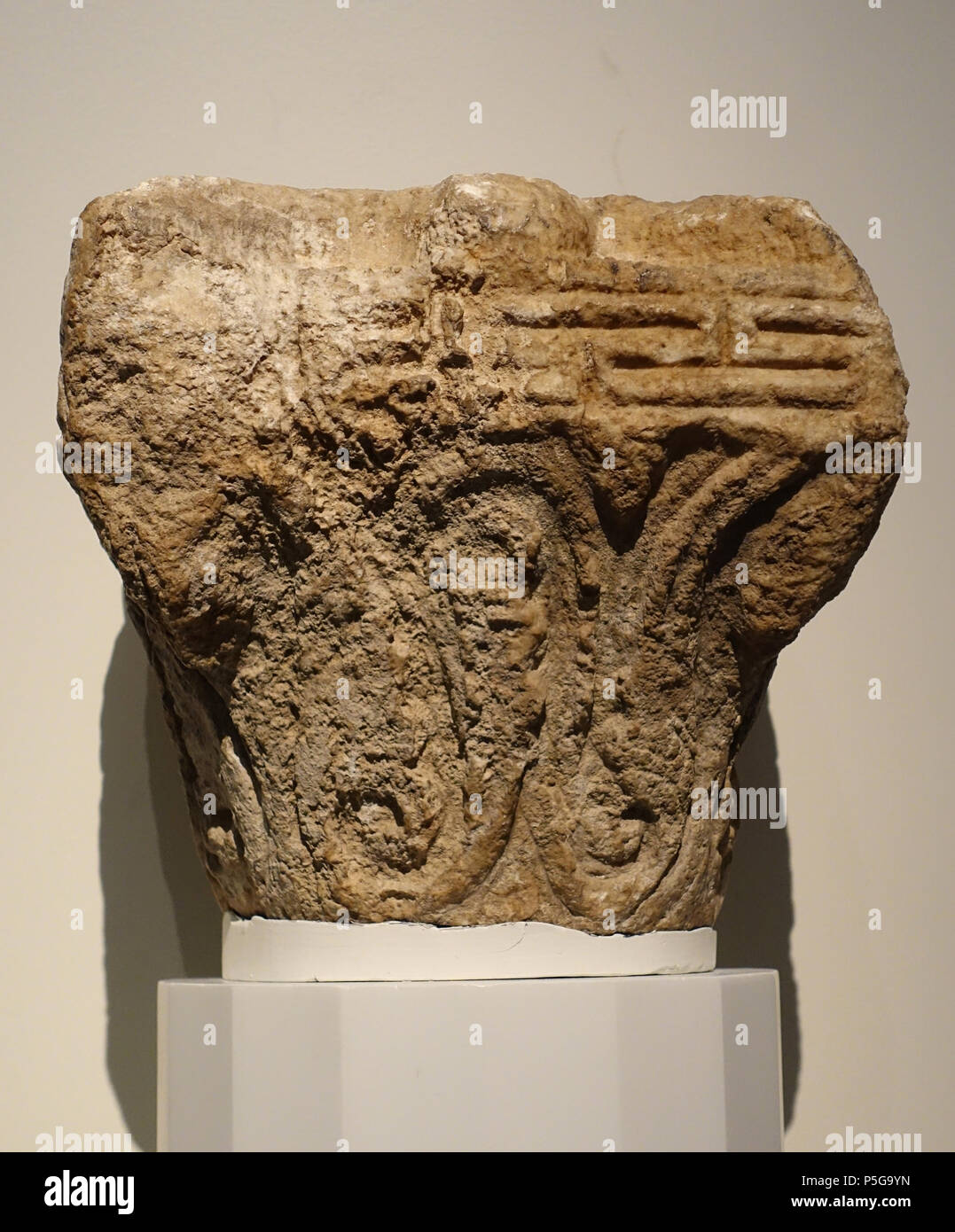 N/A. English: Exhibit in the Aga Khan Museum - Toronto, Canada. This work is old enough so that it is in the . Photography was permitted in the museum without restriction. 6 October 2015, 11:36:15. Daderot 371 Column capital, Historic Syria, late 7th to early 8th century AD, marble, 2 of 2 - Aga Khan Museum - Toronto, Canada - DSC06314 Stock Photo