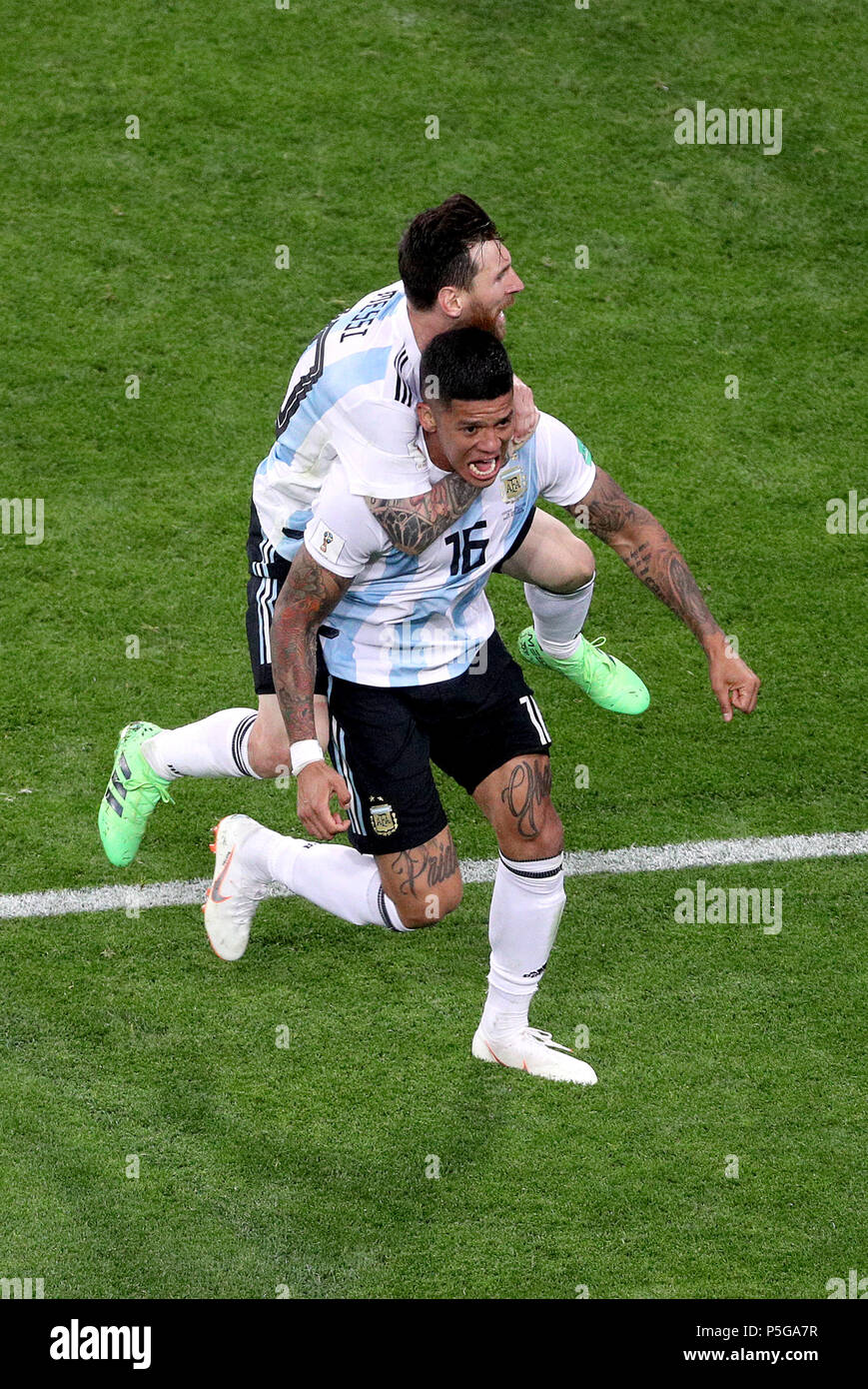 Argentina's Marcos Rojo (front) celebrates scoring his side's second goal of the game with team-mate Lionel Messi (back) during the FIFA World Cup Group D match at Saint Petersburg Stadium. Stock Photo