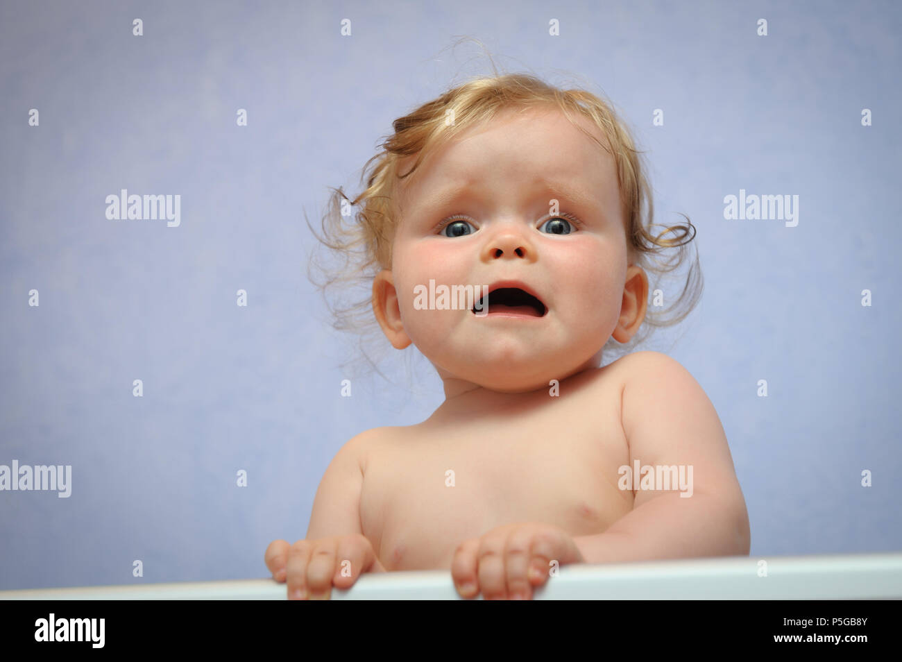 Frightened baby girl Stock Photo