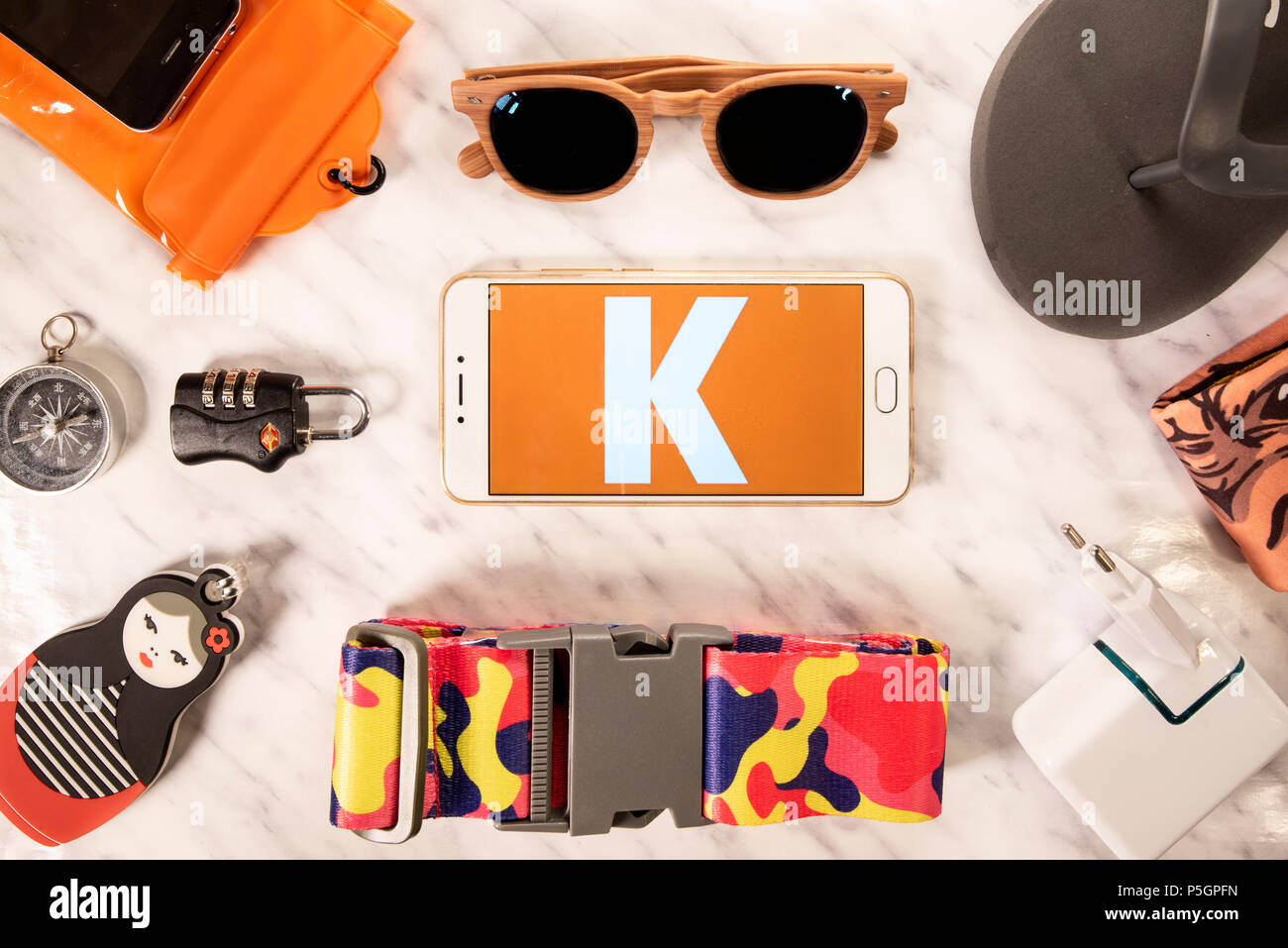 Travel search engines Kayak logo displayed on a smartphone screen next