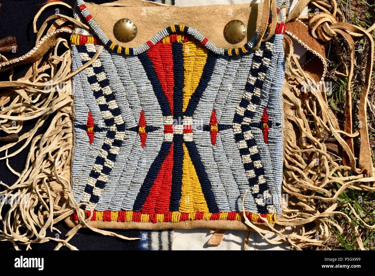 Close up of traditional Native American designed bead pattern on hand crafted pouch on display at Bloody Lake Rendezvous, Woodford, Wisconsin, USA Stock Photo