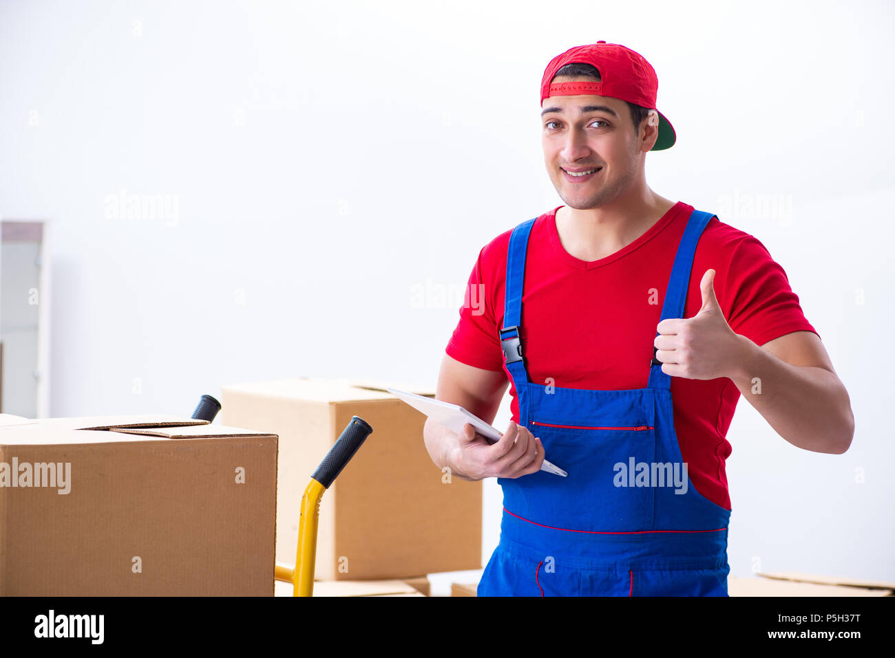 Contractor worker moving boxes during office move Stock Photo
