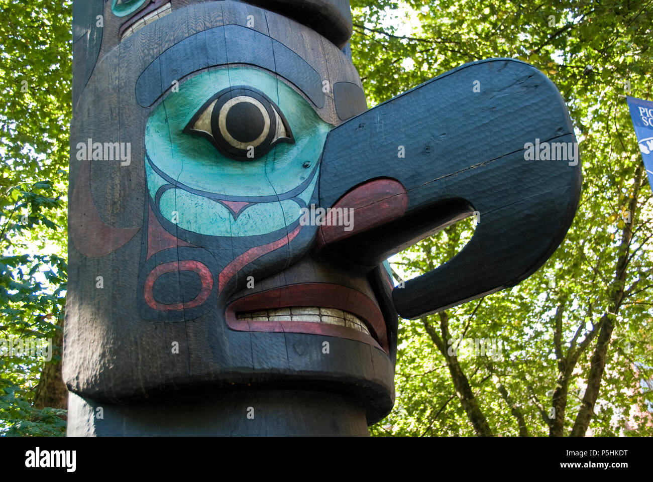 A totem pole (c.1938) carved by the Alaskan Tlingit native tribe stands in Pioneer Square, Seattle. Stock Photo