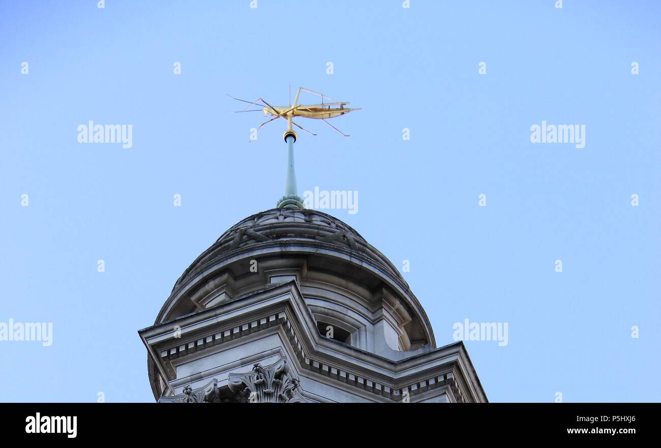 Sir Thomas Gresham's golden gilded Grasshopper weather vane above the Royal Exchange (formerly a trading bourse), London, England, UK, PETER GRANT Stock Photo