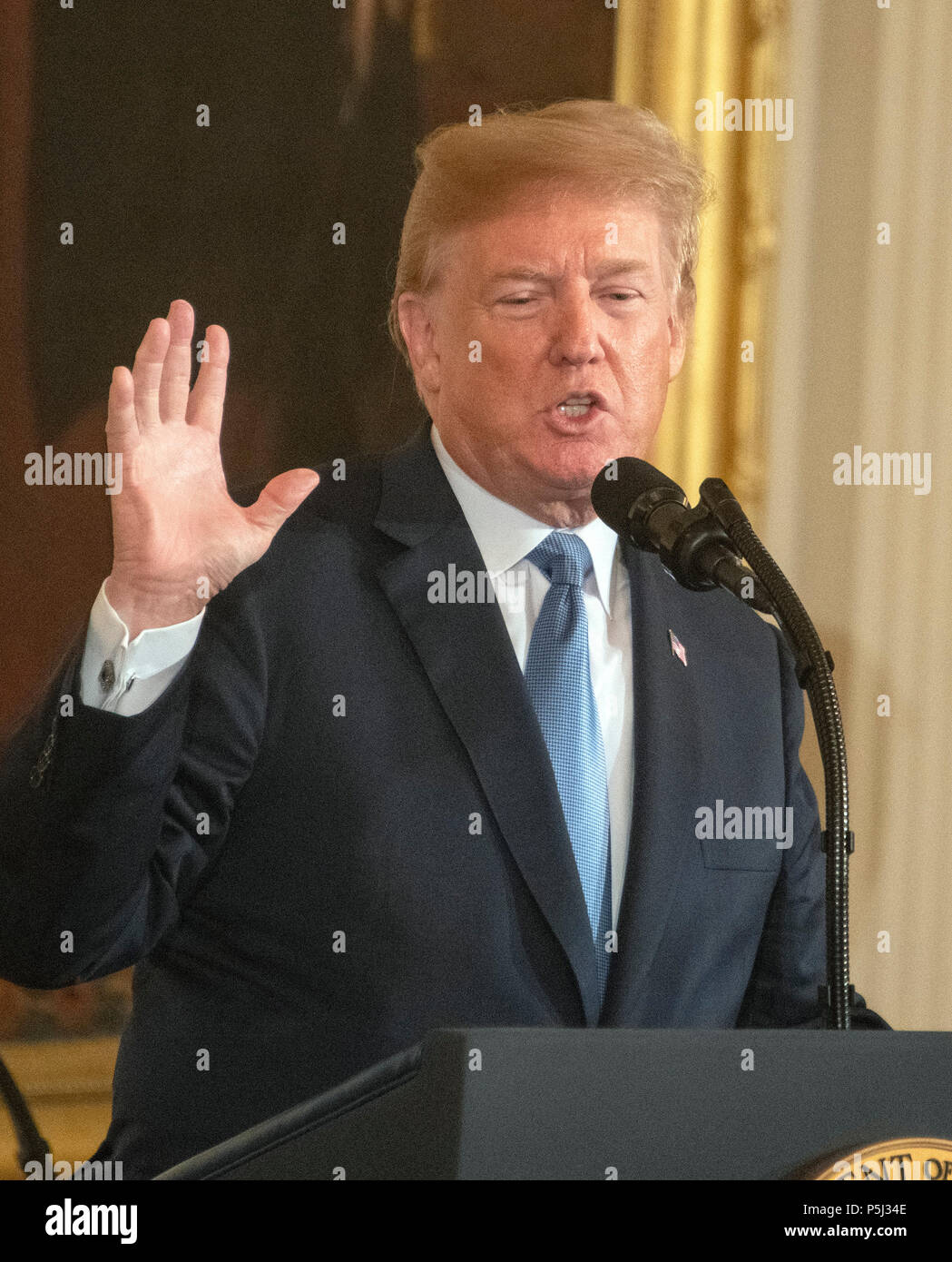 United States President Donald J. Trump makes remarks as he hosts a ceremony to posthumously award the Medal of Honor to then-First Lieutenant Garlin M. Conner, U.S. Army, for conspicuous gallantry during World War II in the East Room of the White House in Washington, DC on Tuesday, June 26, 2018. Conner is being honored for his actions on January 24,1945, while serving as an intelligence officer with Headquarters and Headquarters Company, 3d Battalion, 7th Infantry Regiment, 3d Infantry Division. Credit: Ron Sachs/CNP /MediaPunch Stock Photo