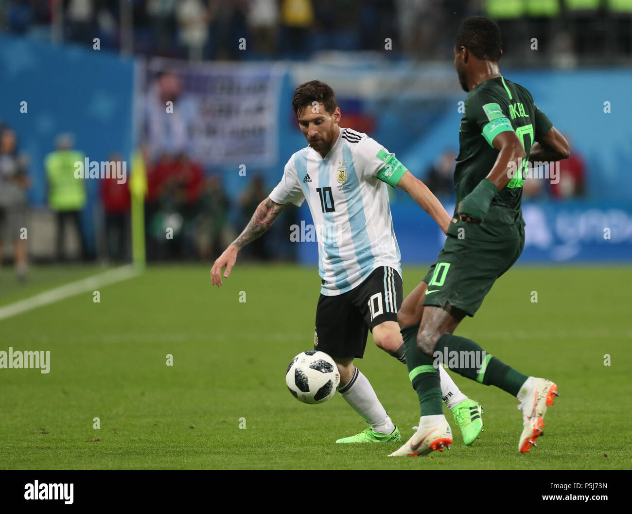 Moscow, Russia. 26th June, 2018. Soccer, World Cup 2018, Preliminary round, Group D, 3rd game day, Nigeria vs Argentina at the St. Petersburg Stadium: Argentina's Lionel Messi and Nigeria's John Obi Mikel (R) vie for the ball. Credit: Cezaro De Luca/dpa/Alamy Live News Stock Photo