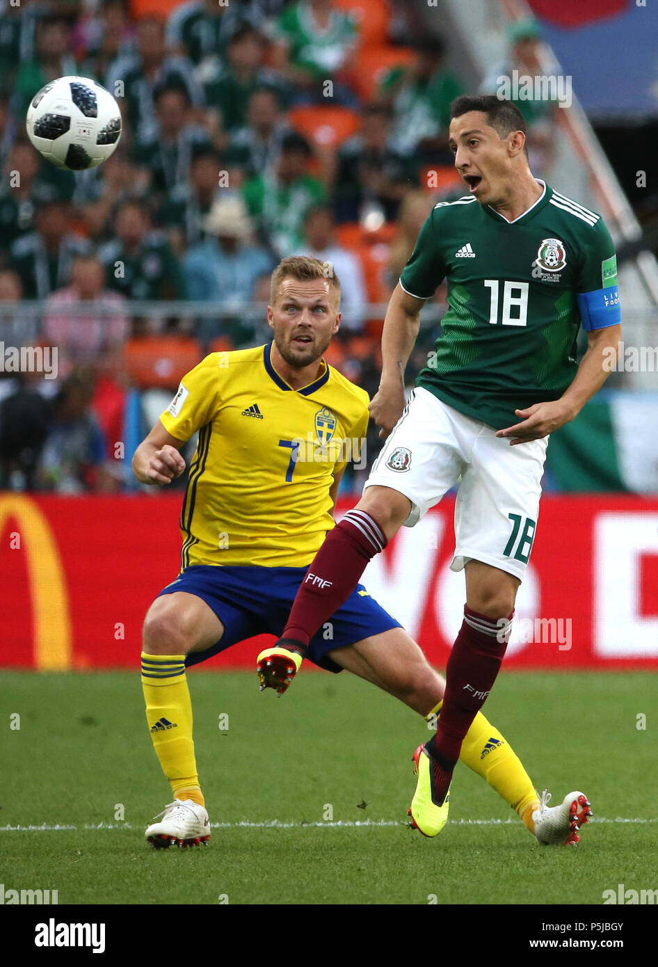 Yekaterinburg, Russia. 27th June, 2018. Andres Guardado (R) of Mexico vies with Sebastian Larsson of Sweden during the 2018 FIFA World Cup Group F match between Mexico and Sweden in Yekaterinburg, Russia, June 27, 2018. Credit: Li Ming/Xinhua/Alamy Live News Stock Photo