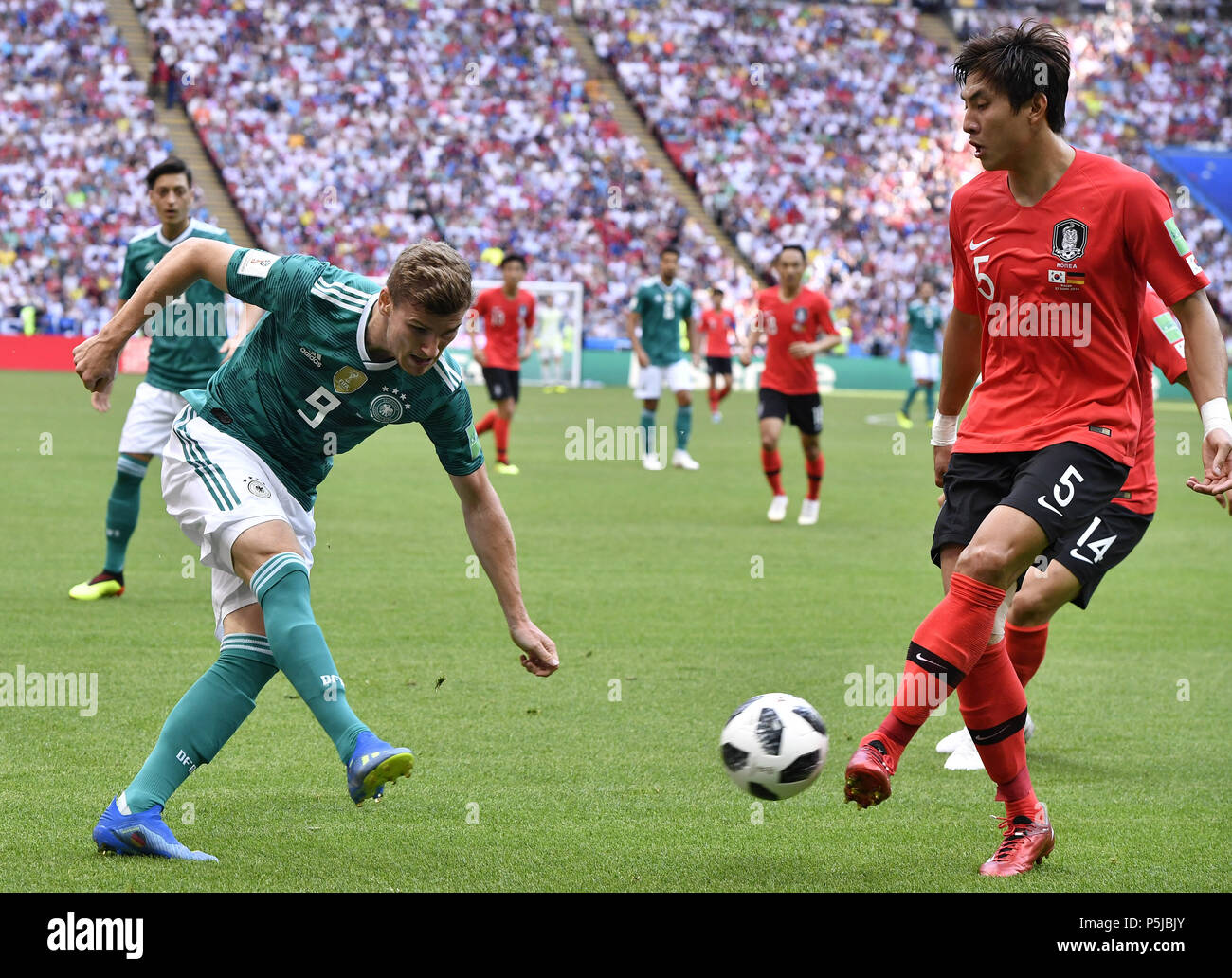 Kazan, Russia. 27th June, 2018. Yun Youngsun (R) of South Korea vies with  Timo Werner of Germany during the 2018 FIFA World Cup Group F match between  Germany and South Korea in