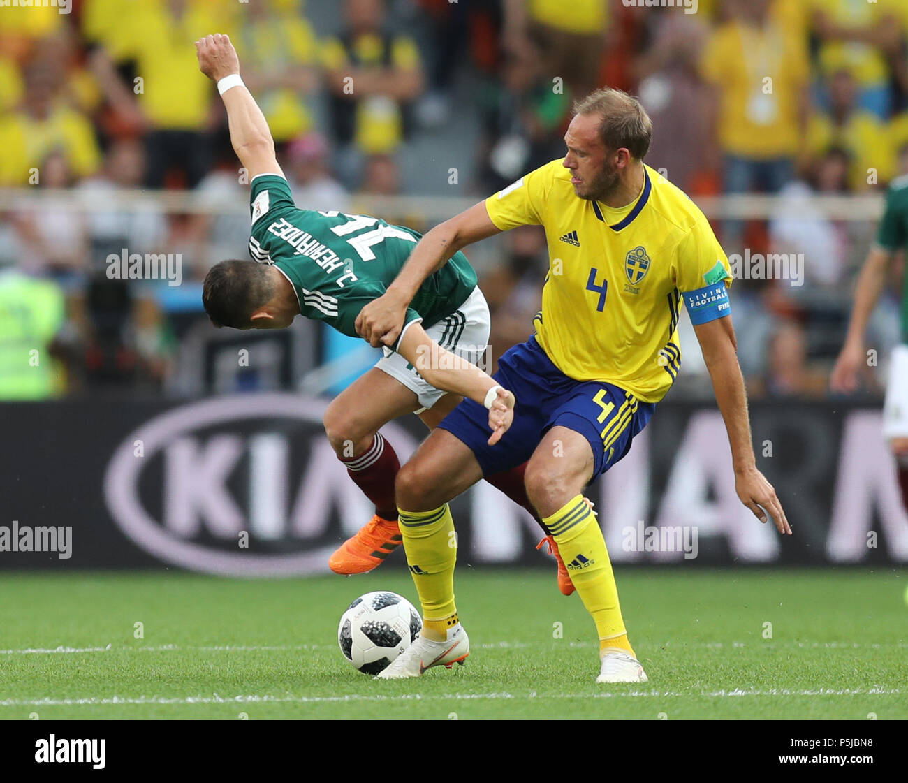 Yekaterinburg, Russia. 27th June, 2018. Javier Hernandez (L) of Mexico vies with Andreas Granqvist of Sweden during the 2018 FIFA World Cup Group F match between Mexico and Sweden in Yekaterinburg, Russia, June 27, 2018. Credit: Lu Jinbo/Xinhua/Alamy Live News Stock Photo