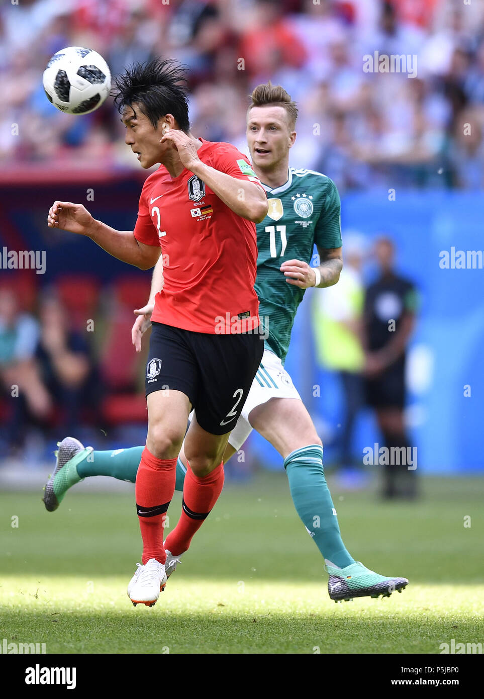 Kazan, Russia. 27th June, 2018. Marco Reus (R) of Germany vies with Lee Yong of South Korea during the 2018 FIFA World Cup Group F match between Germany and South Korea in Kazan, Russia, June 27, 2018. Credit: Chen Yichen/Xinhua/Alamy Live News Stock Photo