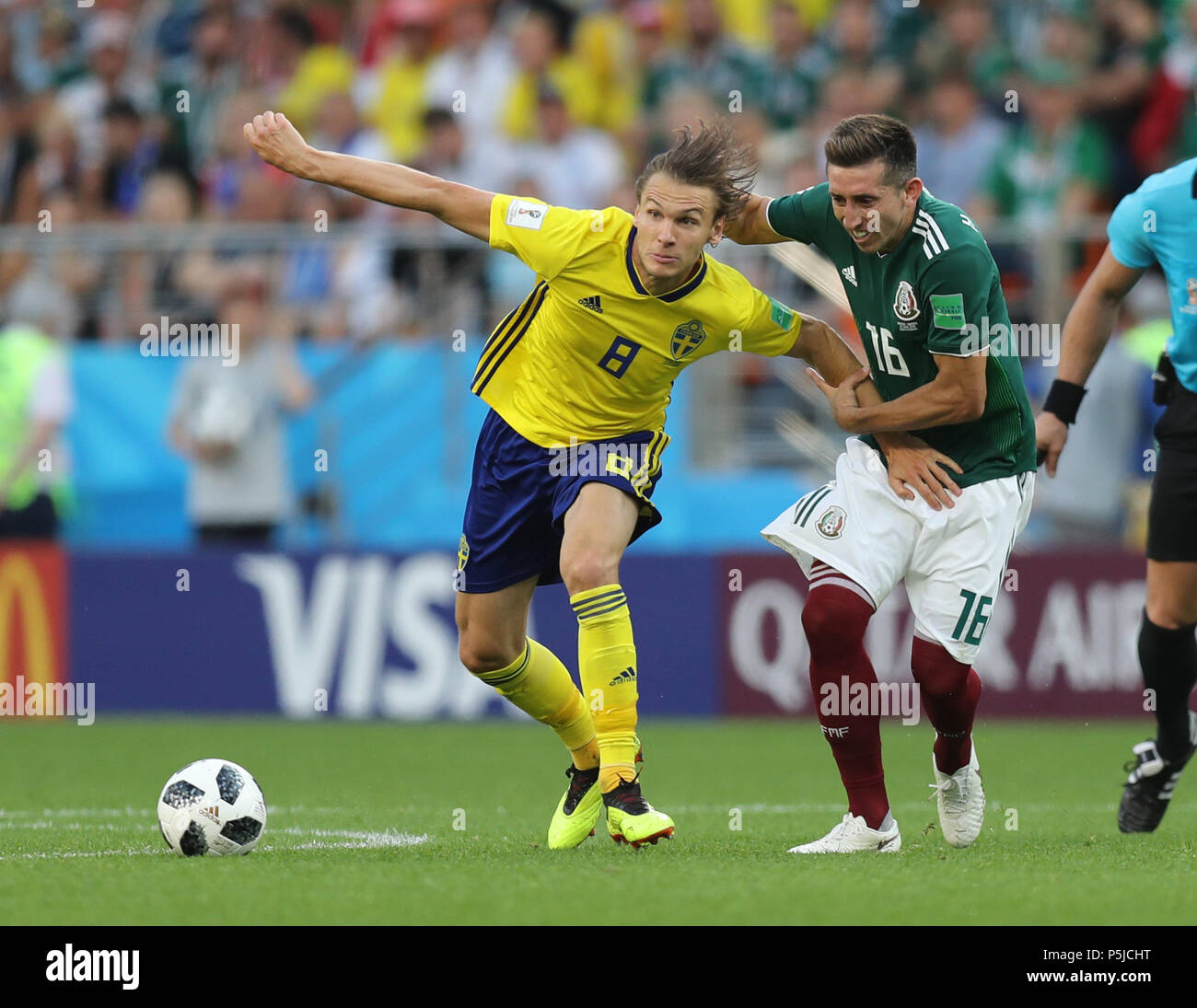 Yekaterinburg, Russia. 27th June, 2018. Albin Ekdal (L) of Sweden vies with Hector Herrera of Mexico during the 2018 FIFA World Cup Group F match between Mexico and Sweden in Yekaterinburg, Russia, June 27, 2018. Credit: Lu Jinbo/Xinhua/Alamy Live News Stock Photo