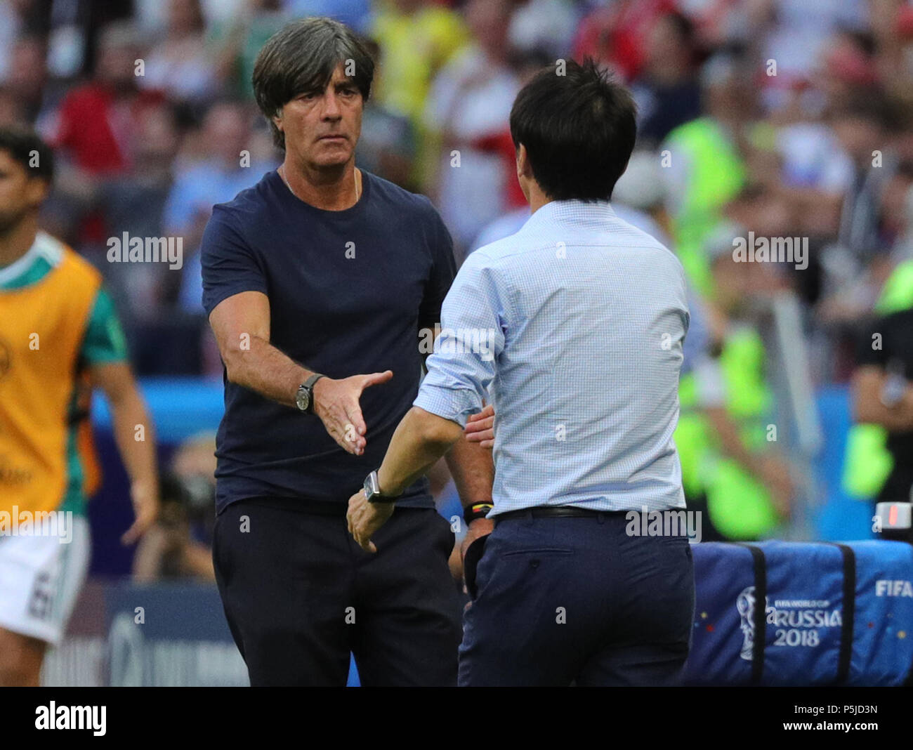 Kazan, Russia. 27th June, 2018. Soccer, World Cup, group F preliminaries, Germany vs South Korea at the Kazan-Arena. Germany's trainer Joachim Loew (l) and South Korean trainer Tae-Yong Shin. Credit: Christian Charisius/dpa/Alamy Live News Stock Photo