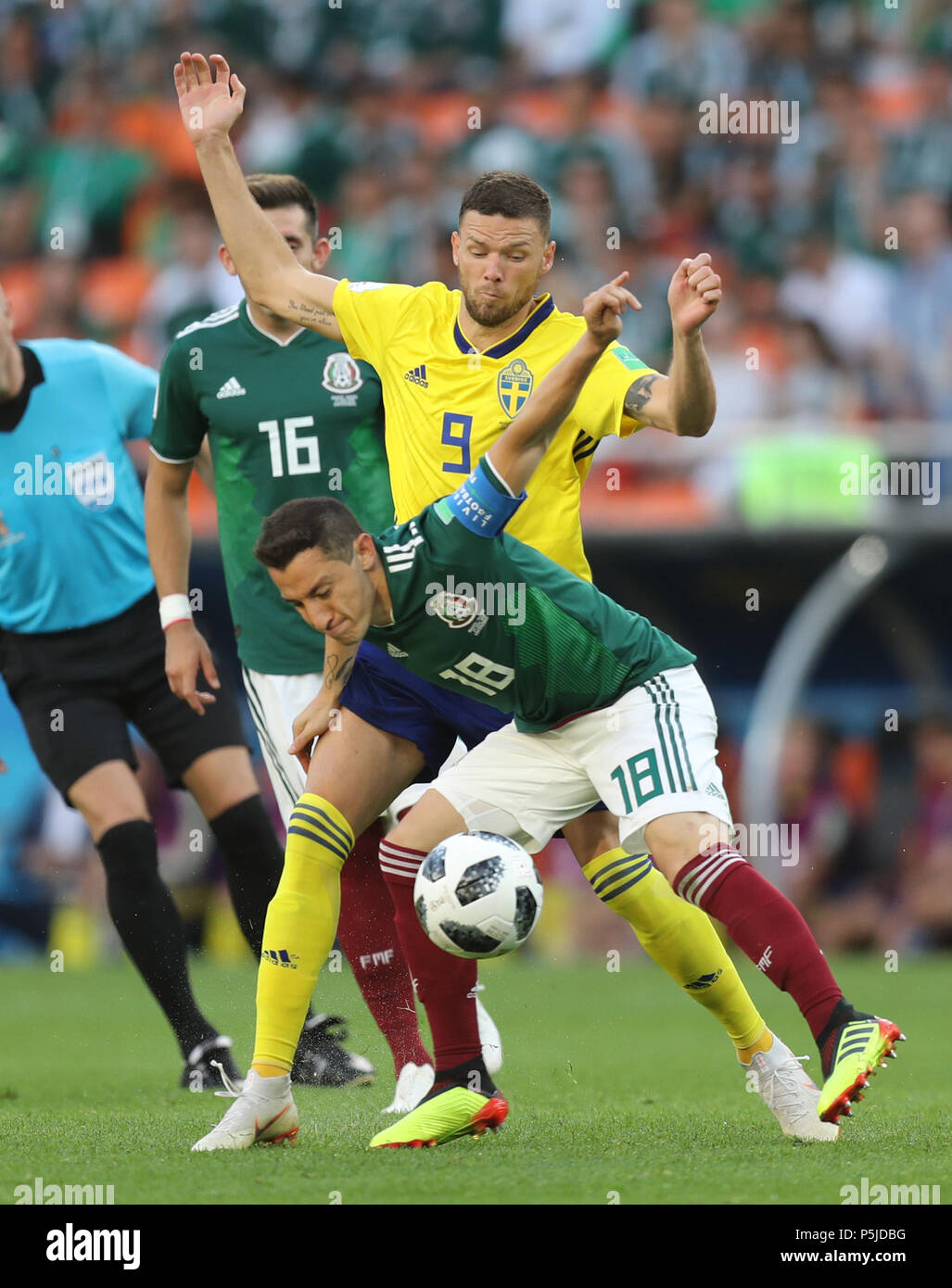 Yekaterinburg, Russia. 27th June, 2018. Andres Guardado (bottom) of Mexico vies with Marcus Berg of Sweden during the 2018 FIFA World Cup Group F match between Mexico and Sweden in Yekaterinburg, Russia, June 27, 2018. Credit: Lu Jinbo/Xinhua/Alamy Live News Stock Photo