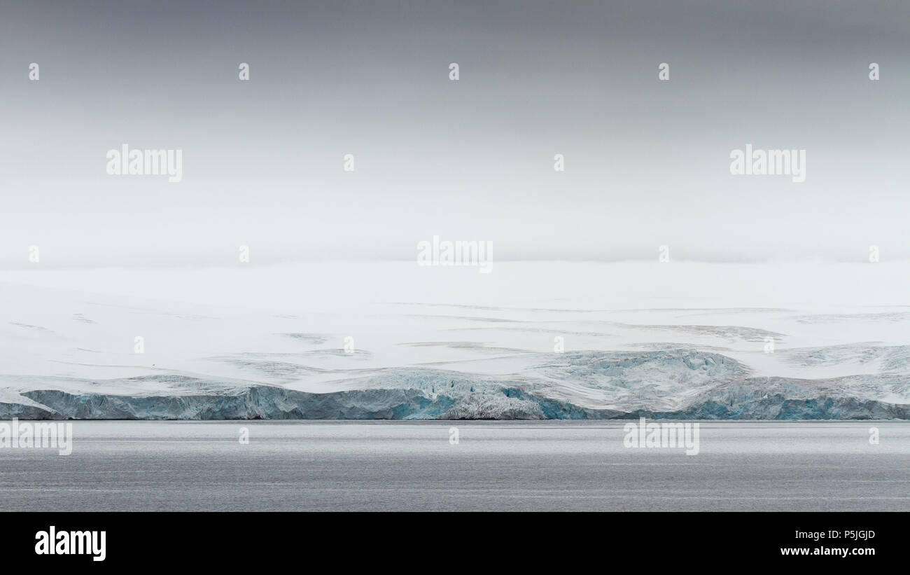 Glacier terminus meets ocean, Antarctica Stock Photo