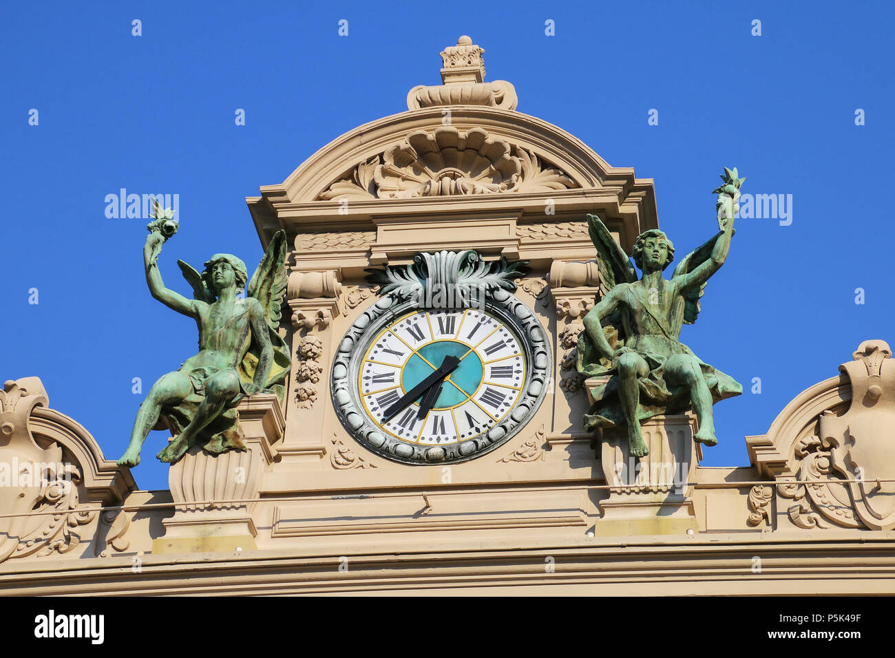 Clock above the main entrance of Monte Carlo Casino in Monaco. Monte Carlo Casino is a gambling and entertainment complex. Stock Photo