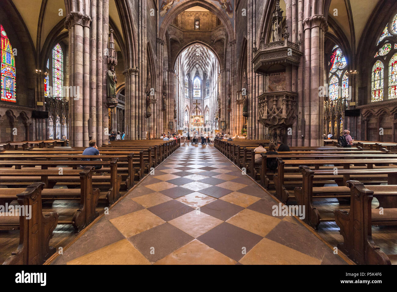 Classic interior view of famous Freiburg Minster Cathedral, in the beautiful town of Freiburg im Breisgau, Baden-Wurttemberg, Germany Stock Photo