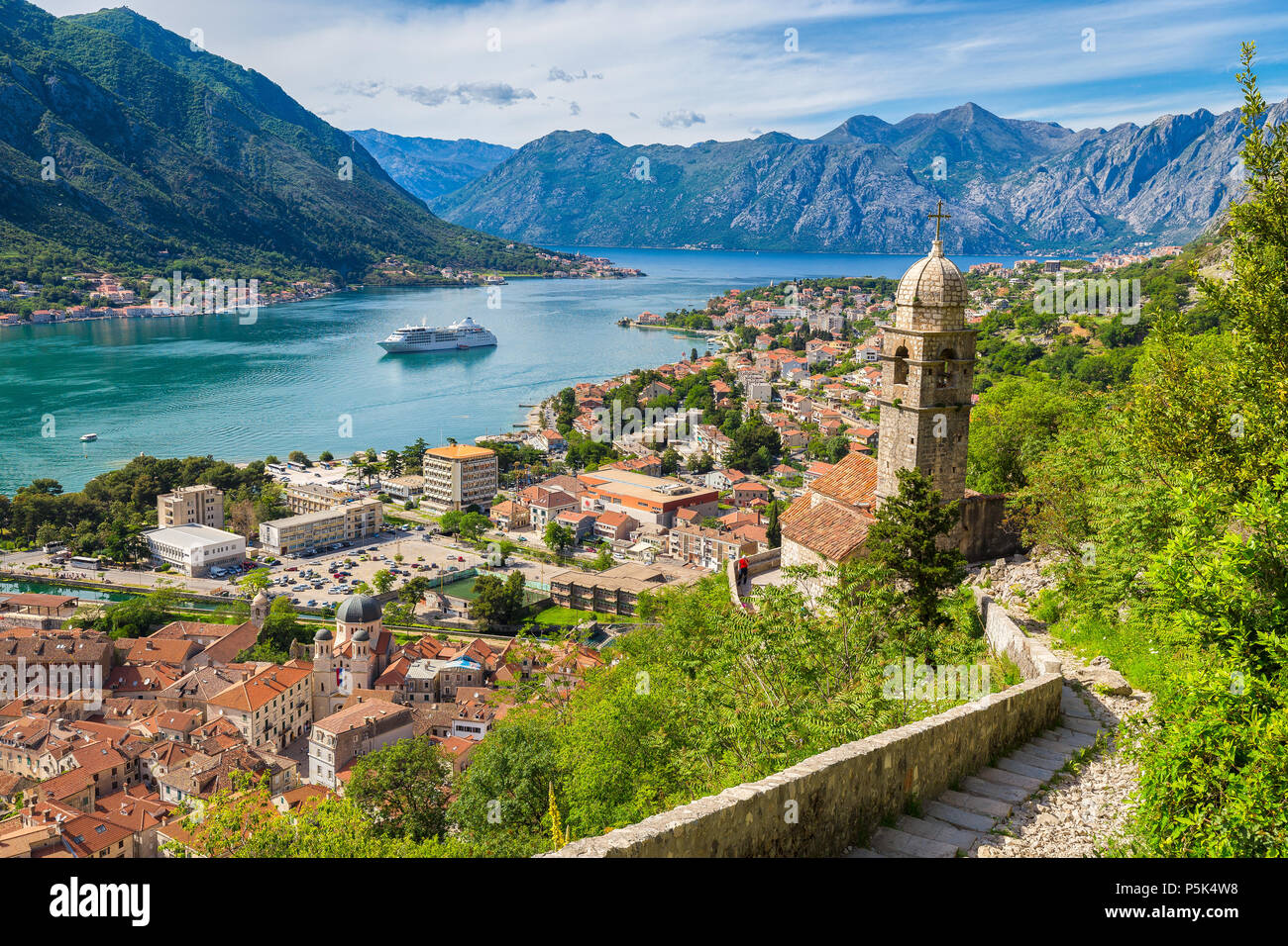 Scenic panoramic view of the historic town of Kotor with famous Bay of Kotor on a beautiful sunny day with blue sky and clouds, Montenegro, Balkans Stock Photo