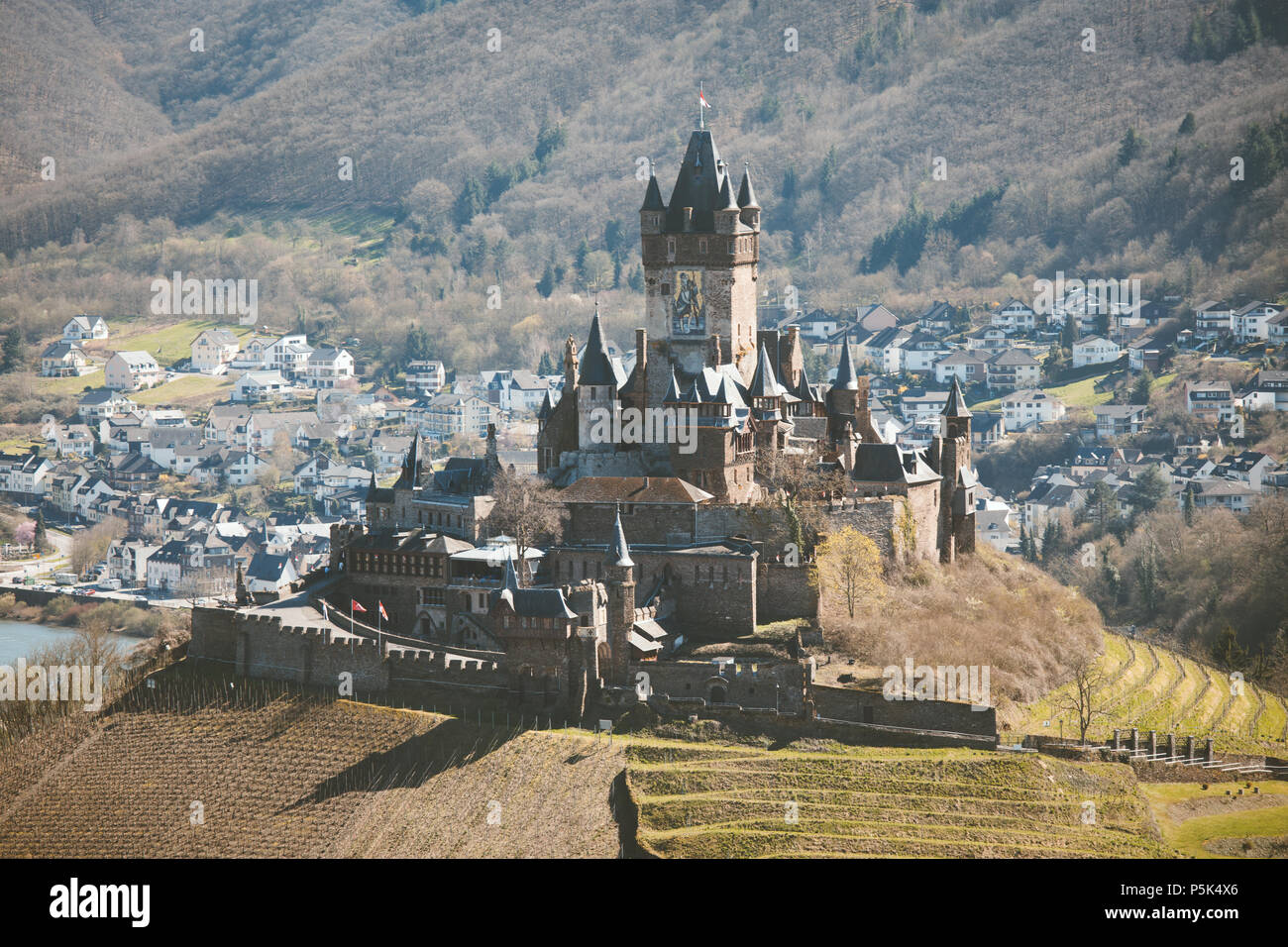 Historic town of Cochem with famous Reichsburg castle on top of a hill and scenic Moselle river on a sunny day, Rheinland-Pfalz, Germany Stock Photo