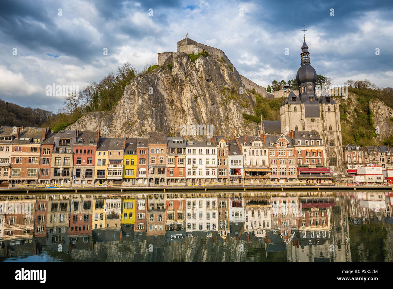 Classic view of the historic town of Dinant with scenic River Meuse in beautiful golden evening light at sunset, province of Namur, Wallonia, Belgium Stock Photo