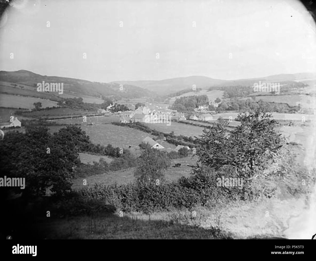 [A view of Llansannan from Hendre Wood] [graphic].. 1 negative : glass, dry plate, b&w ; 16.5 x 21.5 cm. circa 1885. Thomas, John, 47 A view of Llansannan from Hendre Wood NLW3361746 Stock Photo