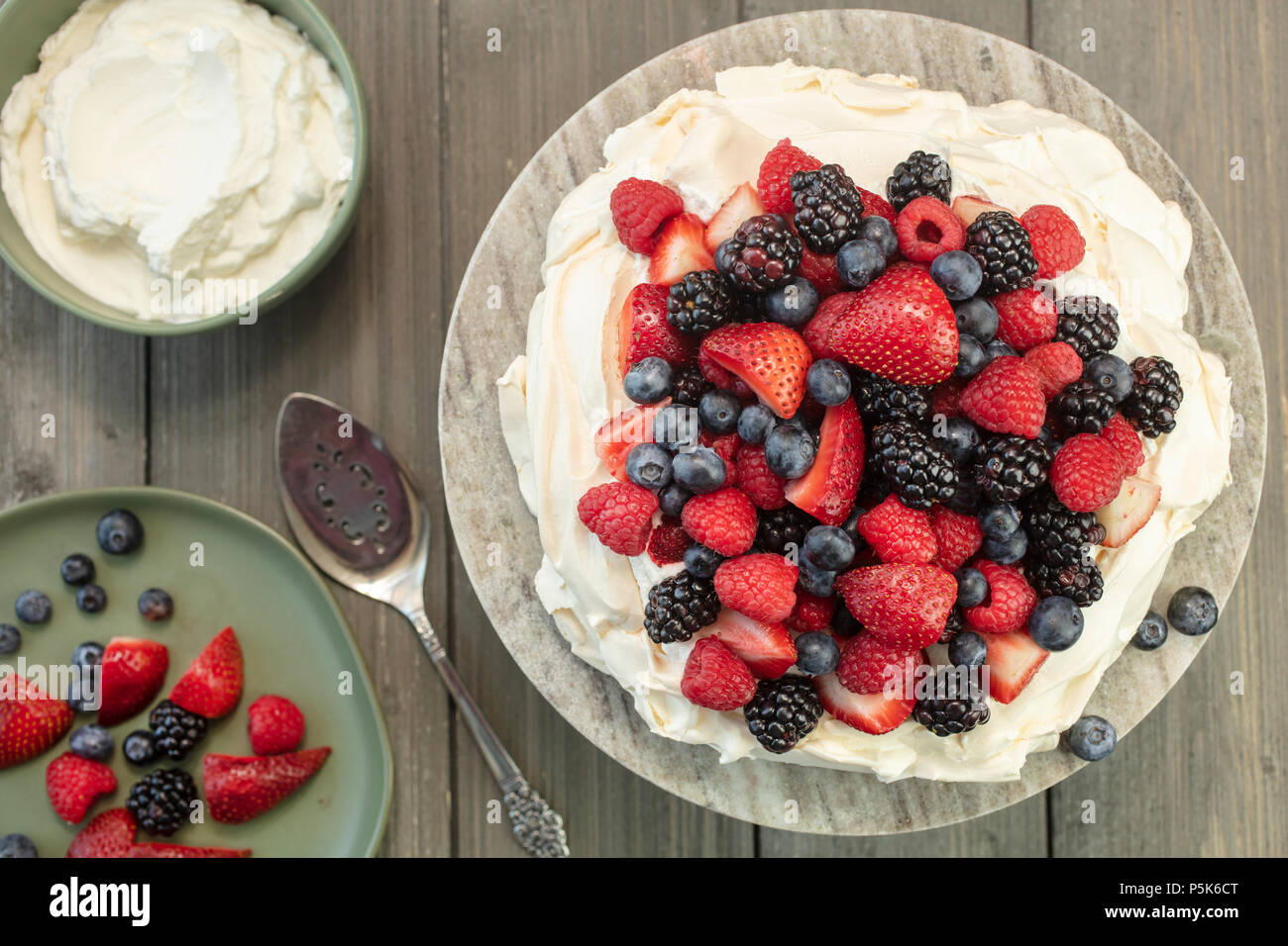 Pavlova meringue cake dessert made with strawberries, blackberries